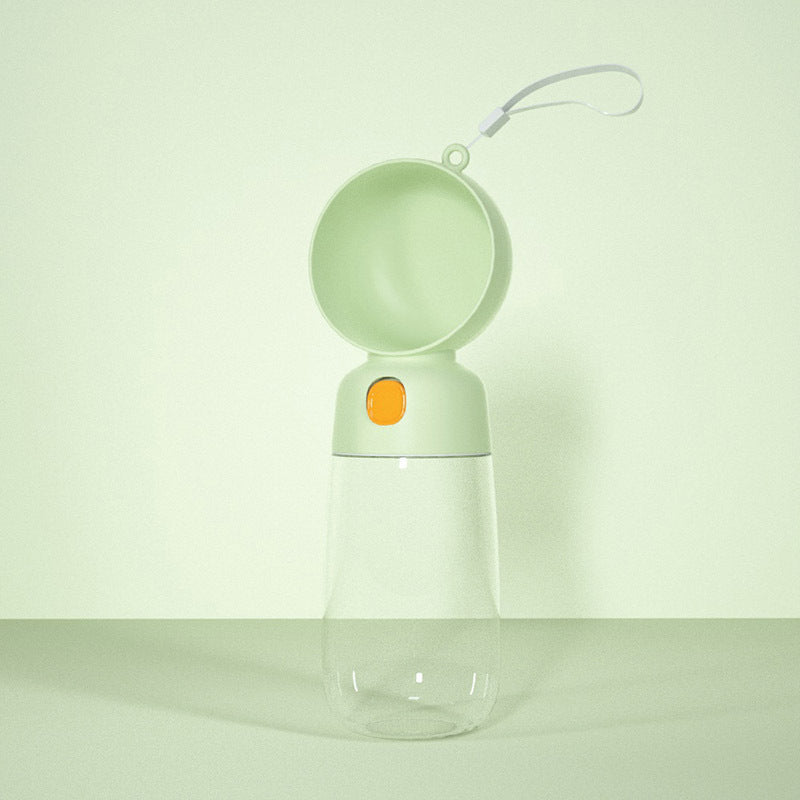 Clear water bottle with a green cap and orange button on a light green background