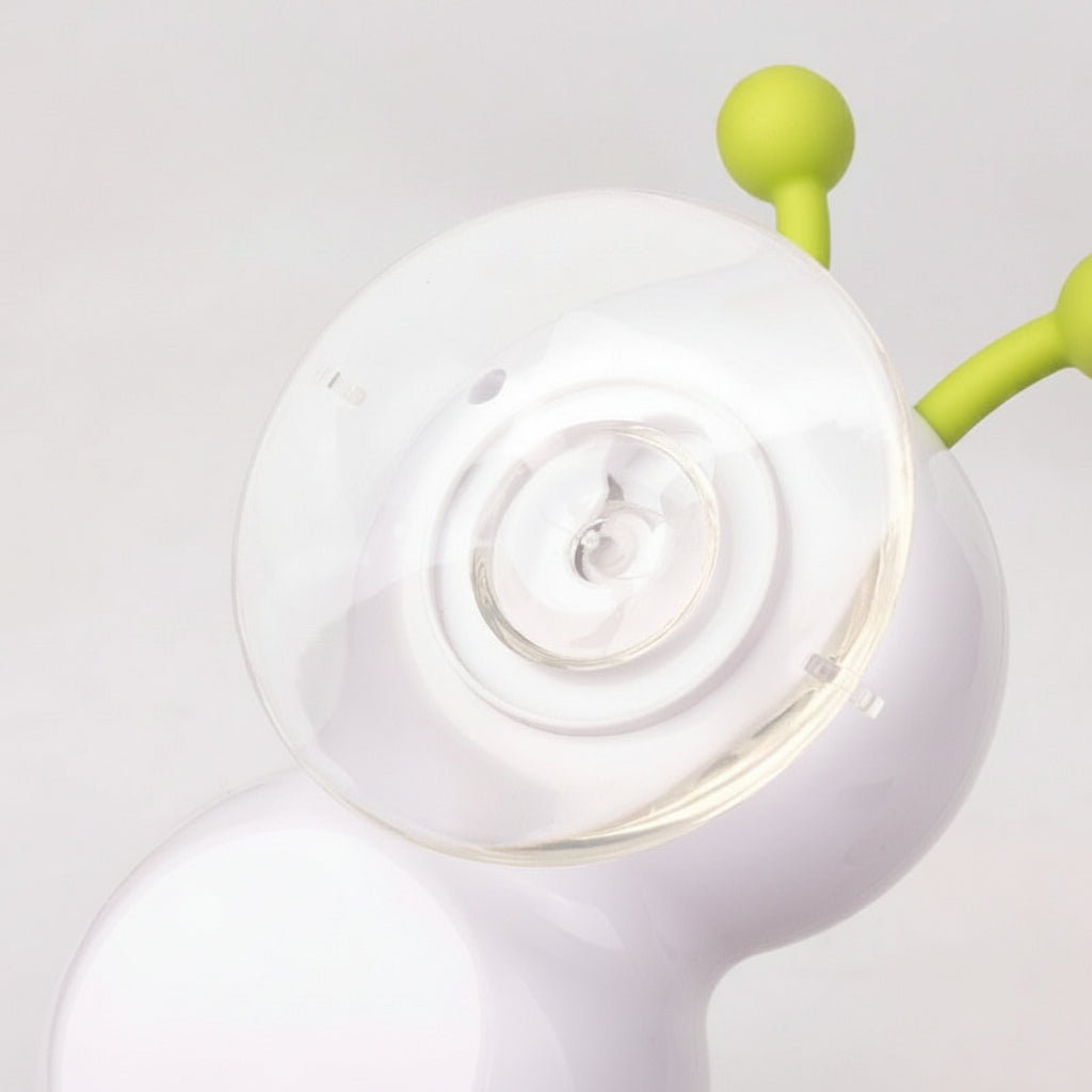 Close-up of a white suction cup with green arm on a light gray background