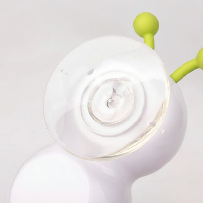 Close-up of a white suction cup with green arm on a light gray background