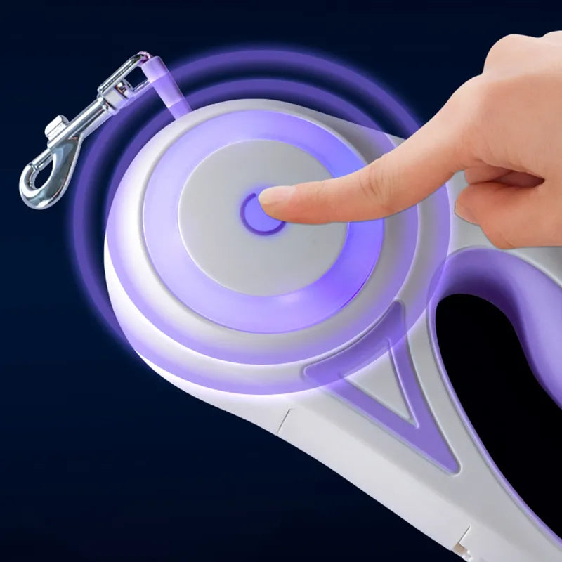 Purple and white retractable dog leash with a hand pressing a button on a dark background