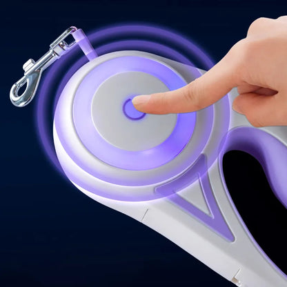 Purple and white retractable dog leash with a hand pressing a button on a dark background