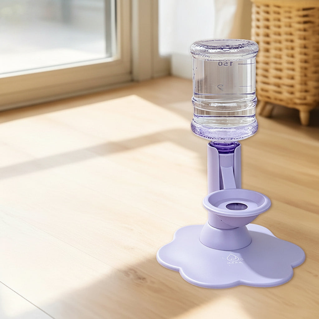 Purple height-increasing water dispenser with a clear water bottle, shown on a wooden floor with an inset detailing included accessories.