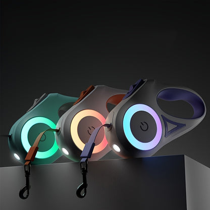 Three colorful dog leashes with LED lights on a dark background