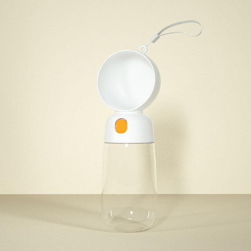 Clear water bottle with a white cap and orange accent on a beige background