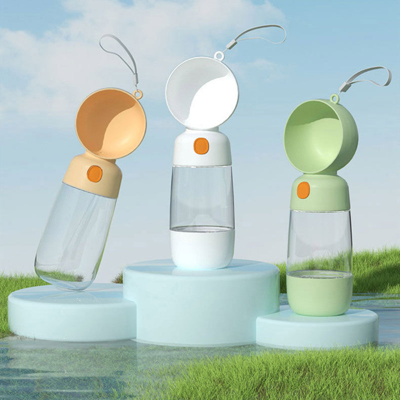 Three portable lamps with different colored tops on a grassy outdoor background