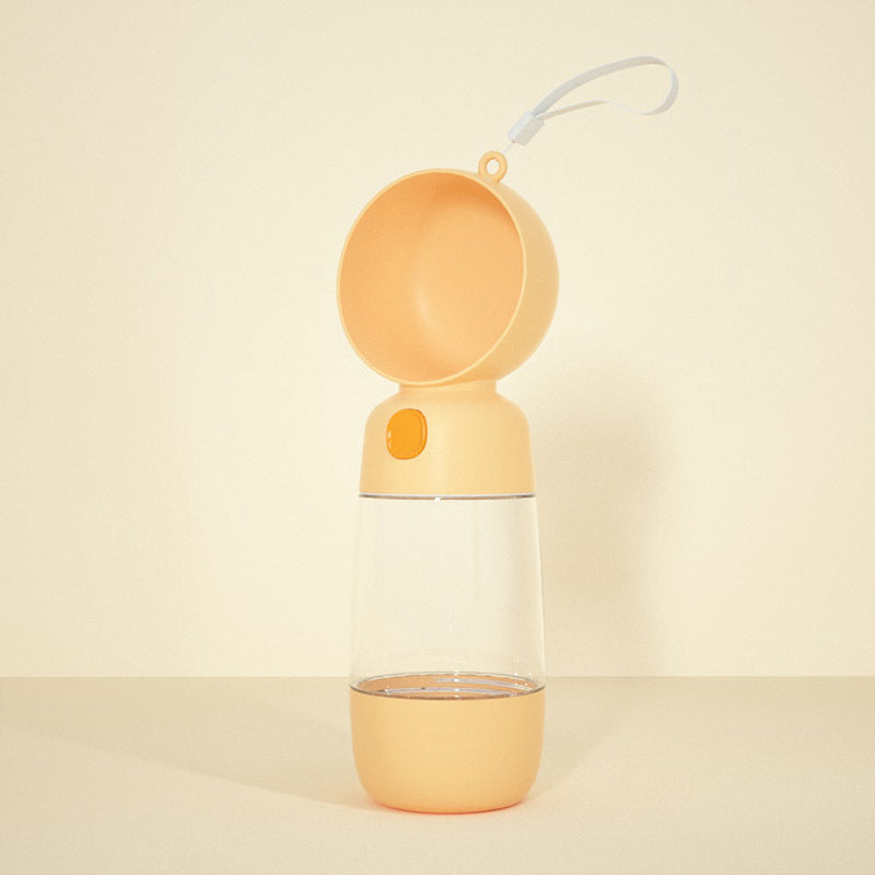 Yellow portable lamp with a clear base on a beige background