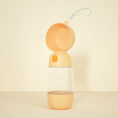 Yellow portable lamp with a clear base on a beige background